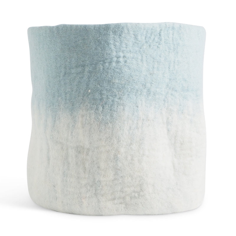 Aveva Flower Pot 18, Aveva’s handmade flowerpots in 100% wool with a flat bottom and two different colors blend together, creating a lovely ombré effect. The inside is coated with natural rubber that makes the flowerpot waterproof. Follow the care instructions below