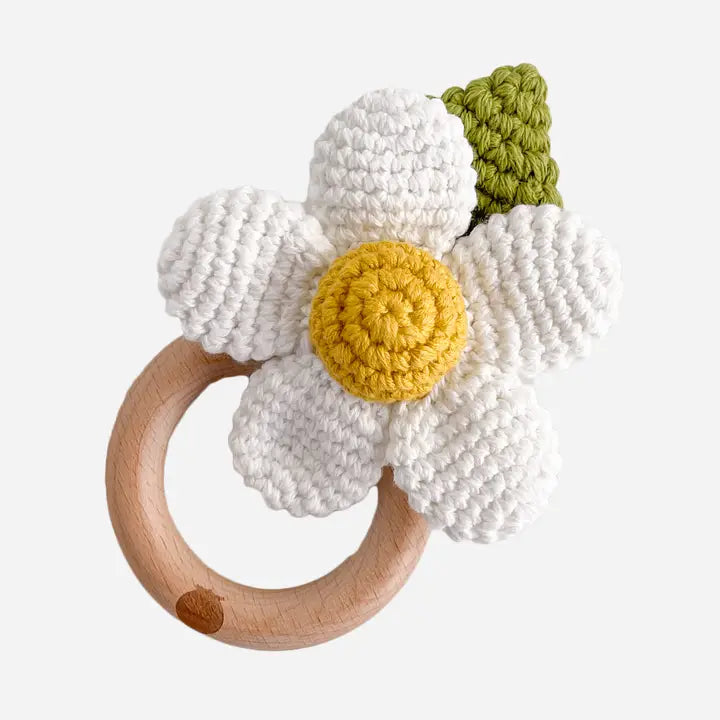 Crocheted flower teething ring with wooden ring perfect for newborns.