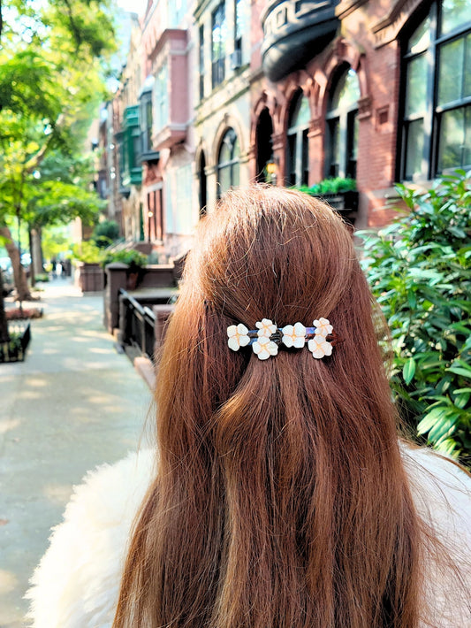 The Vintage Flowers French Barrette is hand-painted with delicate floral motifs inspired by antique wallpaper, pressed petals, and the soft elegance of a bygone era. It’s a graceful nod to vintage charm—perfect for sweeping back your hair with ease and beauty.