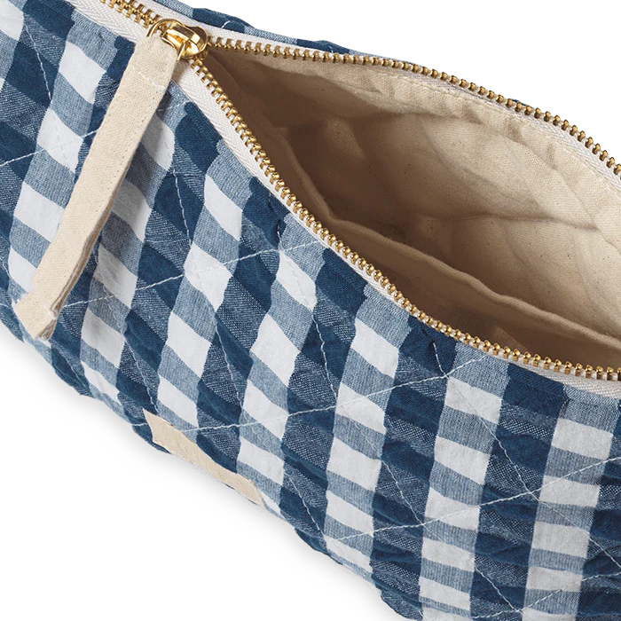 Measuring 9" x 6" x 2", the Nola toiletry bag is a timelessly cool quilted bag perfect for keeping your belongings in one place: makeup, stationery, electronics, or whatever you decide. The Nola bag is as practical as it is sustainable, and as stylish as it is versatile.
