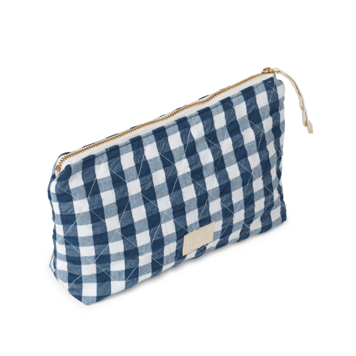 Measuring 9" x 6" x 2", the Nola toiletry bag is a timelessly cool quilted bag perfect for keeping your belongings in one place: makeup, stationery, electronics, or whatever you decide. The Nola bag is as practical as it is sustainable, and as stylish as it is versatile.