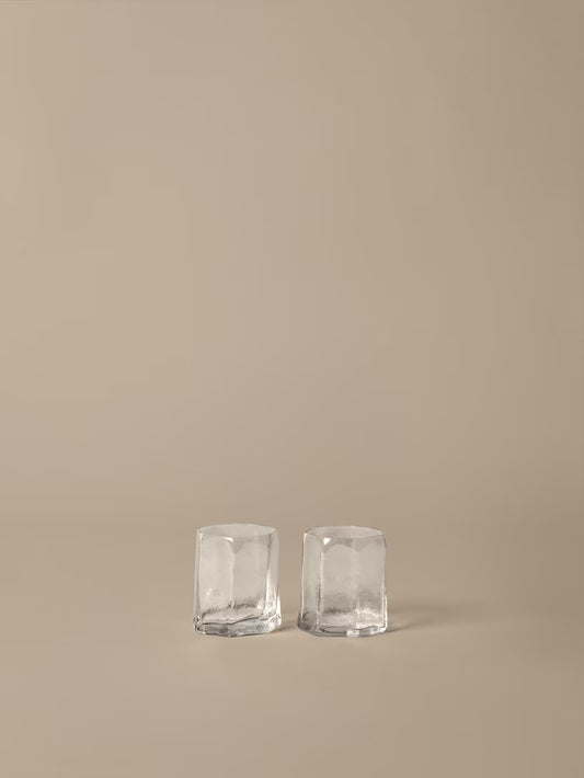 set of two glasses on beige background