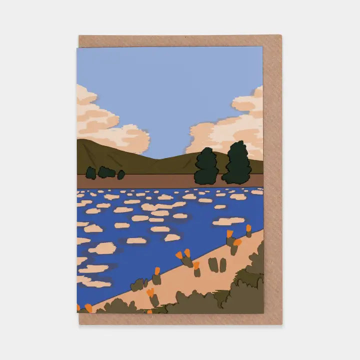 Illustrated landscape with a lake, trees, and mountains on a greeting card.