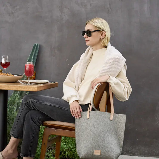 A women enjoying her well crafted bag out for a lunch in Los Angeles.
