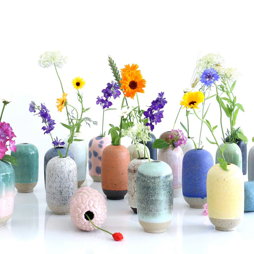 The Mini Yuki, named after the Japanese word for snow, is a hand-thrown, watertight stoneware vase. Based on Studio Arhoj's popular Yuki vase, the mini version is perfect for a handful of tiny flowers or those few surviving flowers left in a withered bouquet. There is almost the same amount of work in a small vase as a large vase - and the same amount of love.