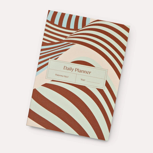 Unstructured structure, for the design-led crowd: the Palermo Undated Daily Planner features a wavy, summery stripe print in pale blue, off-white and burgundy - a fresh, wearable take on pattern that looks great in-store and even better on a desk. Inside, it’s all about freedom: 320 undated pages with a full spread for each weekday, and a split spread for weekends.