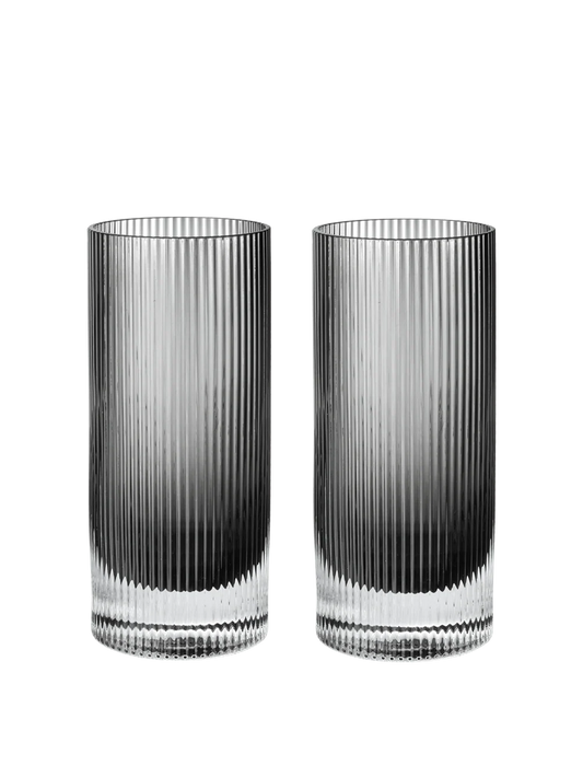 Two tall, clear ribbed glass tumblers with a dark gradient at the bottom, shown side by side on a plain white background.