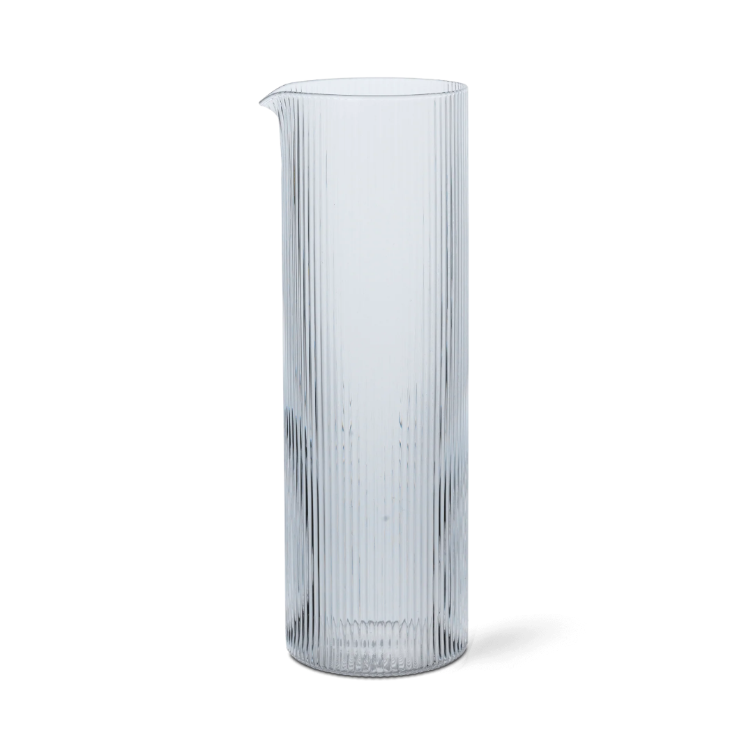 Clear glass vase with ribbed texture on a white background