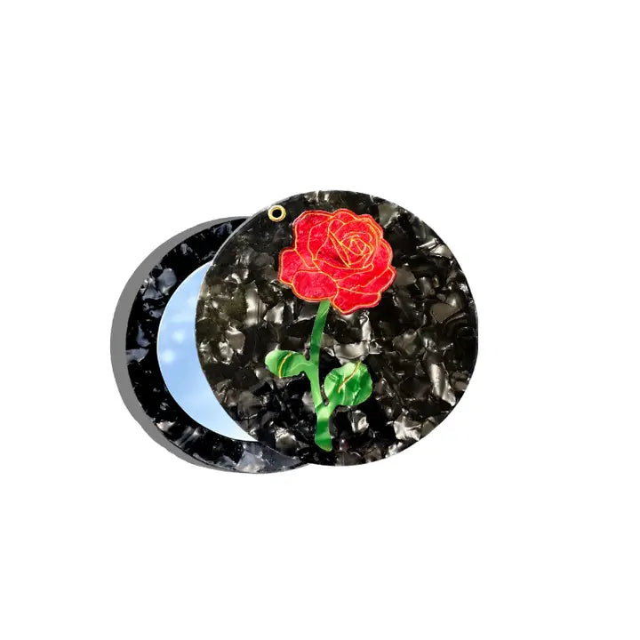 The mirrors are hand painted by artists. Carefully crafted from cellulose acetate - an eco-friendly, biodegradable material made from recycled wood pulp. These signature original designs you can't find anywhere else!