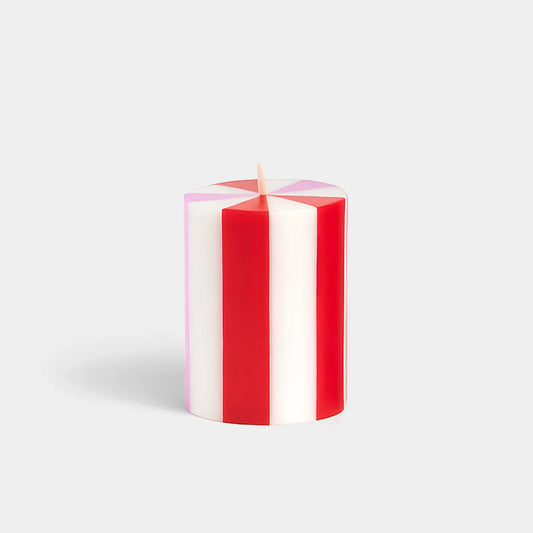 Set of red and white striped candles hand poured in Java, Indonesia using artisanal production techniques. The workshop provides training and fair wages to hundreds of rural women enabling them to support their families.
The wax is 100% plant-based and is RSPO certified to ensure responsible environmental stewardship. They are like a cross section of a candy cane and would look perfect in a pink and red themed holiday decor. They also would be a great addition to a candy themed Christmas. Find it at Huset