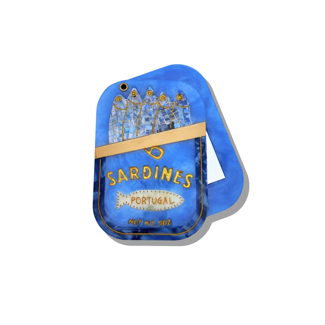 Blue Sardine Mirror is so on brand for a European Summer. Lots of items have been decorated with the tinned fish trend and you should never leave out a handy dandy mirror for your travels.