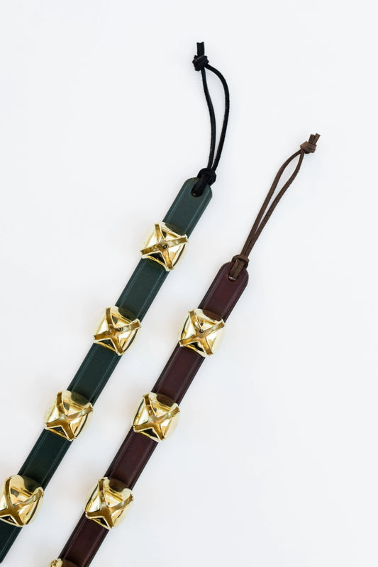 This cheery set of bells can be hung on a door handle for a merry sound to accompany all the holiday comings and goings. Made by Amish craftsman and out of leather and brass materials.