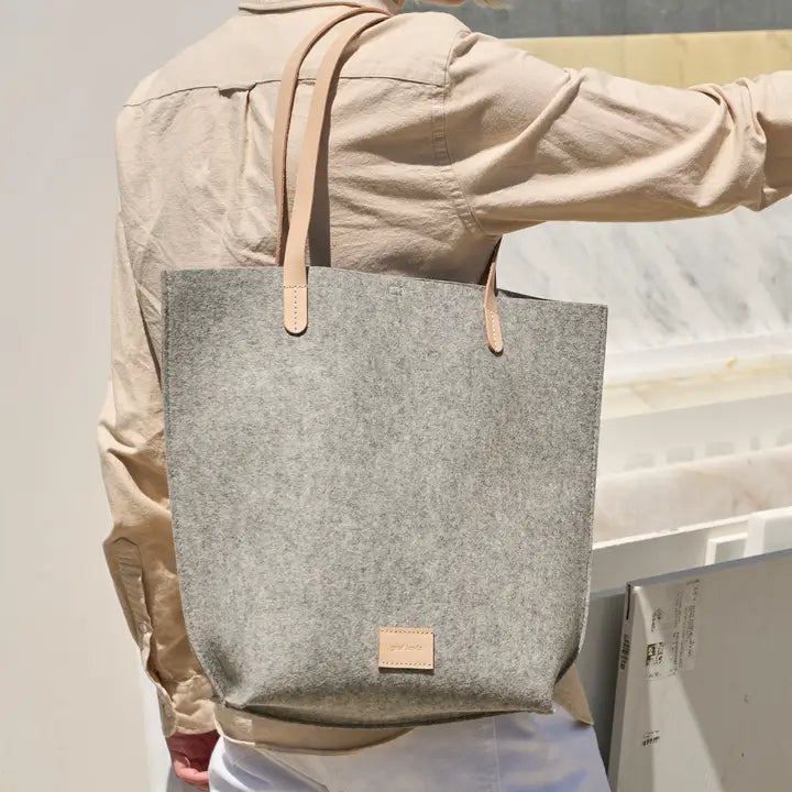 Wool Handbag draped over a shoulder.