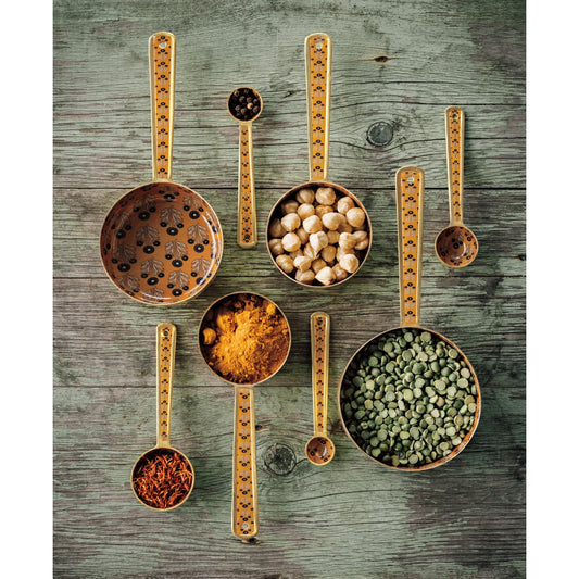 The simple act of preparing a meal is elevated with these printed measuring cups set with a matte gold finish. 