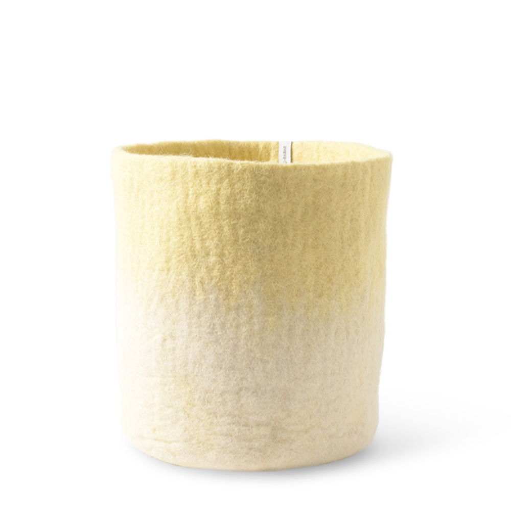 Aveva Flower Pot 18, Aveva’s handmade flowerpots in 100% wool with a flat bottom and two different colors blend together, creating a lovely ombré effect. The inside is coated with natural rubber that makes the flowerpot waterproof. Follow the care instructions below