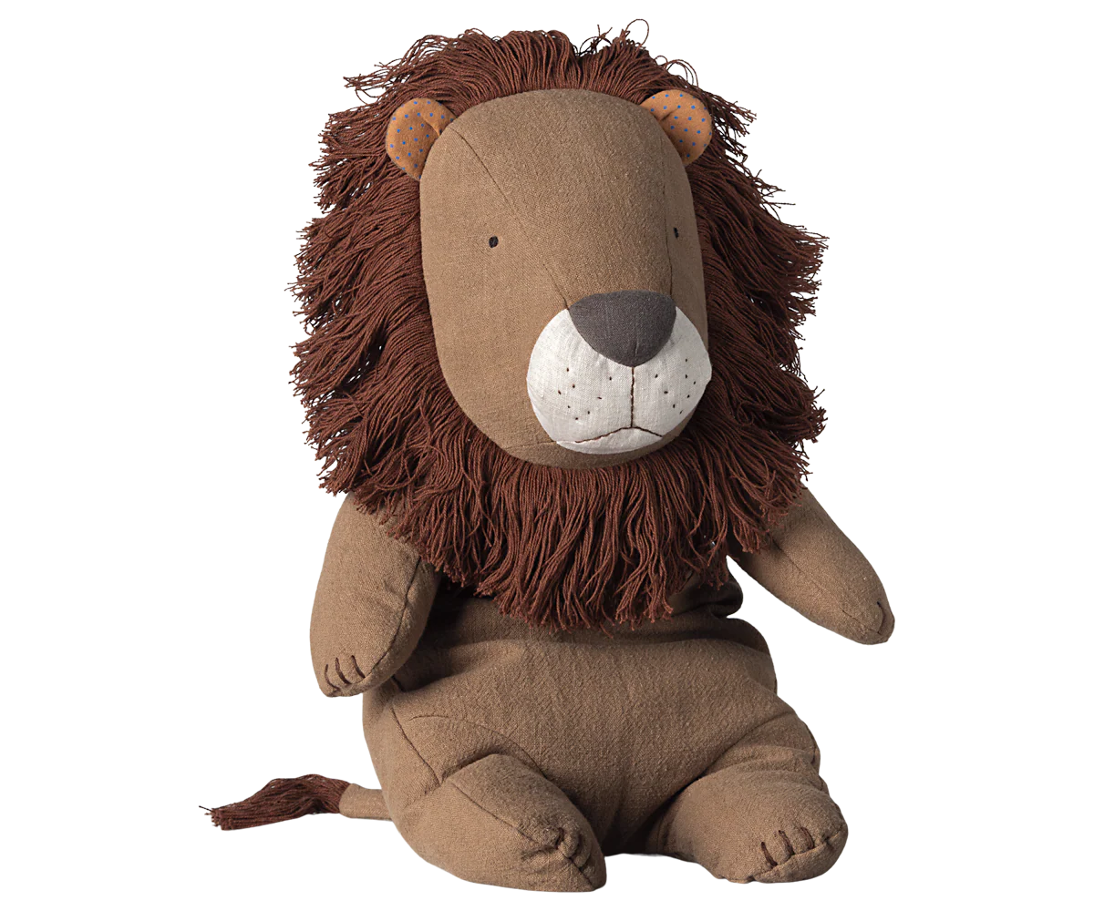 Stuffed lion toy with a brown mane on a white background