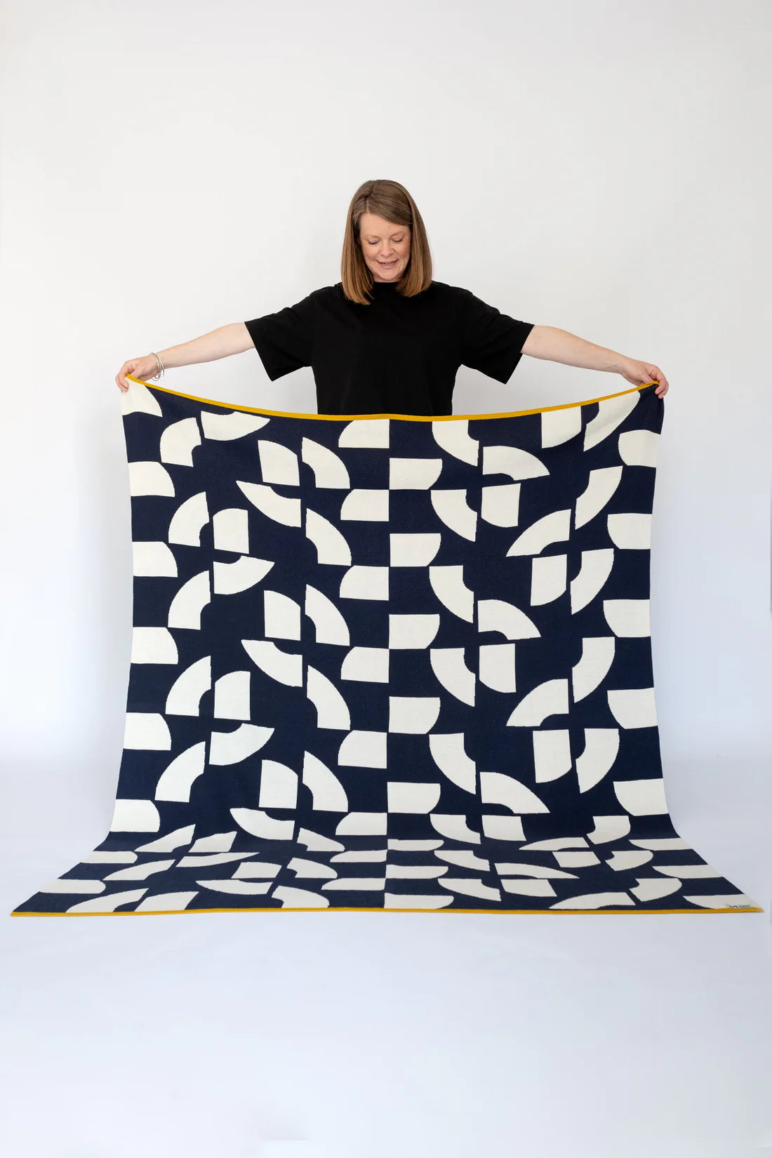 Indulge in the luxurious warmth and style of the Sophie Home Merino Blend Throw Blanket. Made from a premium merino wool blend, this throw blanket not only looks great draped over your furniture, but it also provides unbeatable comfort and coziness on chilly days. Add a touch of sophistication to your home decor with this high-end throw blanket.