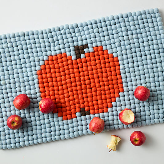 the cutest doormat featuring an apple made of 100% wool so perfect for that un pop art moment in your space.