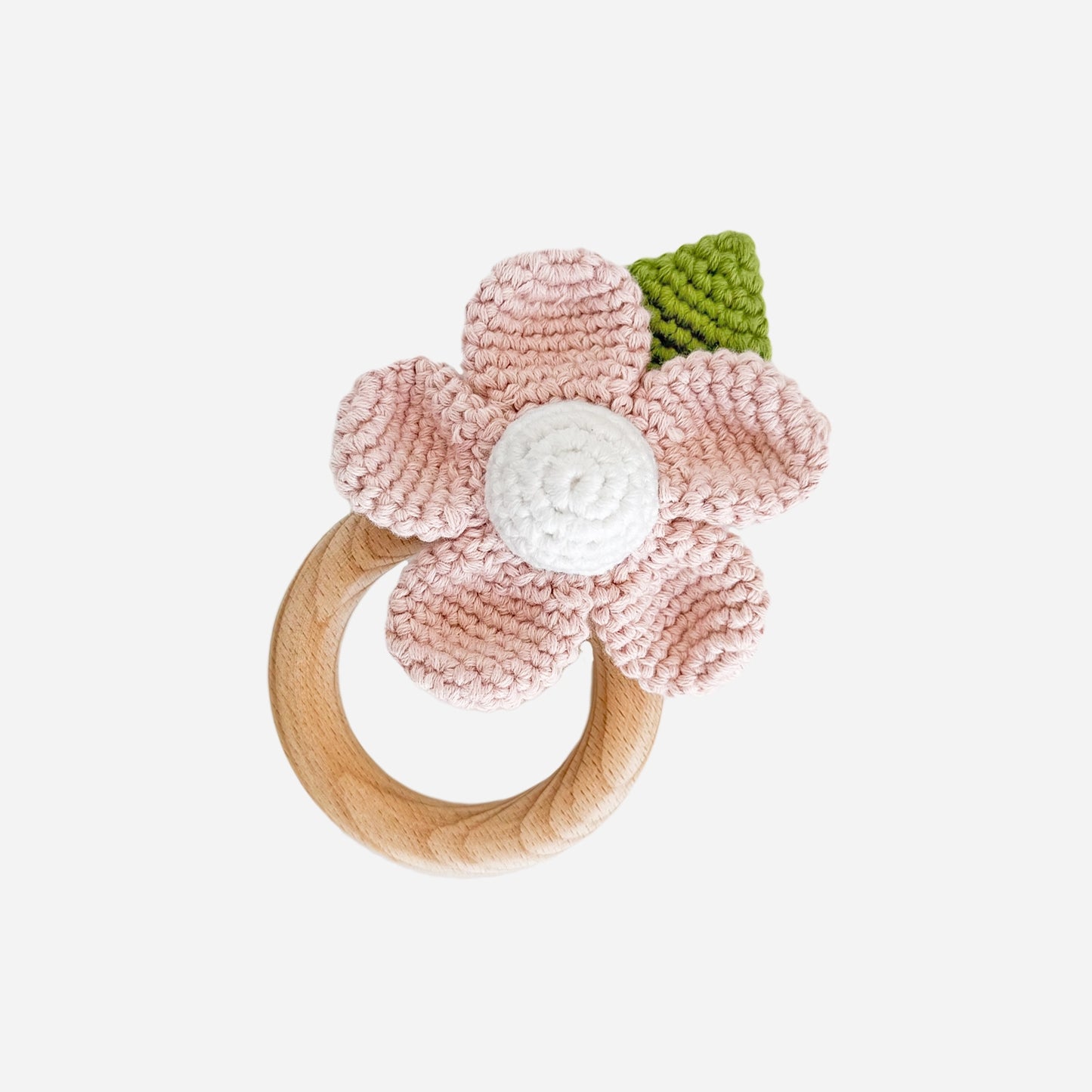 Floral wooden teething ring with pink crochet flower that you can find at Huset Shop in Venice California on the famous Abbot Kinney Boulevard. Kids baby shower presents