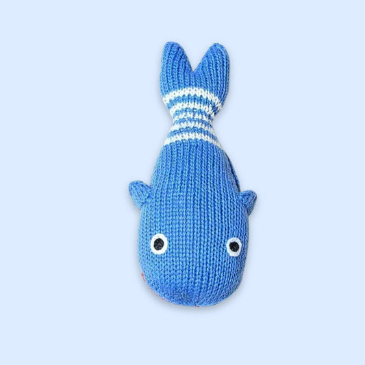 Organic baby gift set featuring a whale lovey, rattle, and striped hat