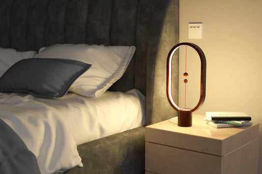 Heng Balance Lamp is controlled by two wooden spheres. When you lift the lower wooden sphere, it will be attracted by the hanging one and remain suspended in mid-air, switching on the light. It is not a source of light, but also a piece of art. The gentle curve makes it easy to the eye and calming. The outside frame of the lamp is made of beech, making it natural and warm to the touch. Red Dot Award Winner