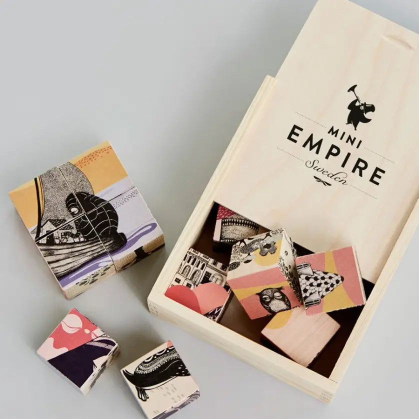 These wooden blocks are made of fine Sycamore maple. 12 pieces of fun with 6 characteristic Mini Empire illustrations. Each block measures 4x4x4 cm. Packed in a beautiful wooden box . 