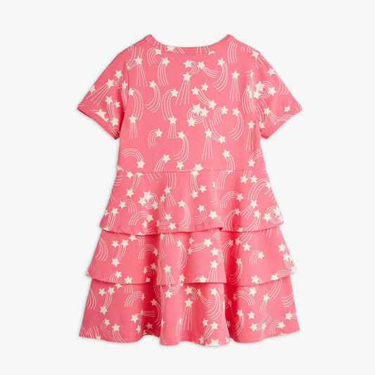 Pink dress with white star and moon pattern on a white background