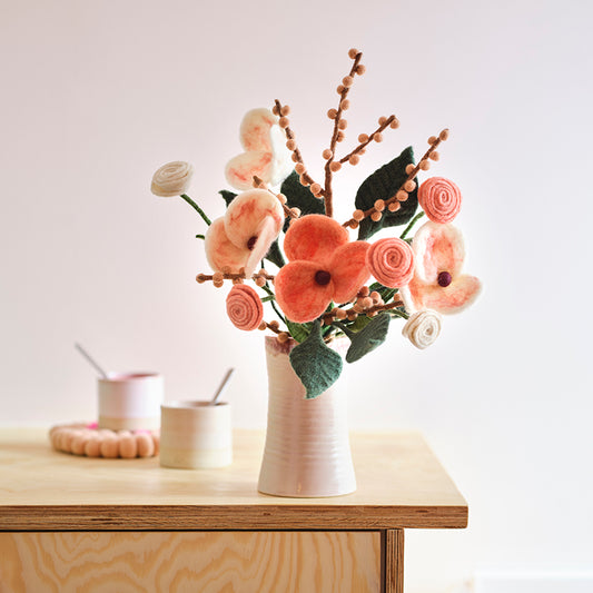 Aveva Wool Flower Bouquets that spark joy and will last you a lifetime. No more having to re buy flowers to fill the empty vases around your home, you can bring a touch of nature inside with colorful bouquets made with sustainable wool. This is the tokyo bouquet in a vase on display.