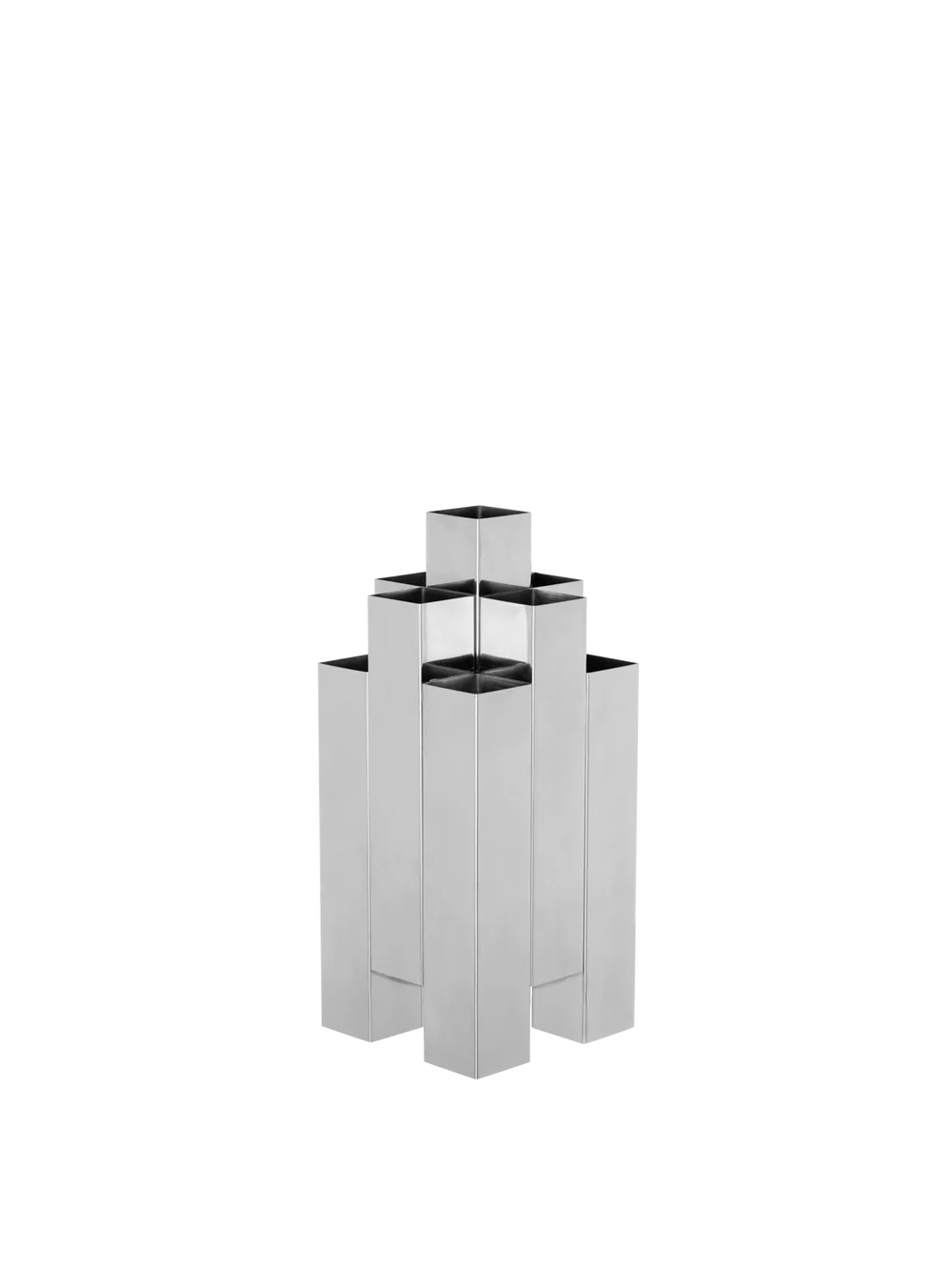 The Tessera Vase brings sculptural character to the home with its striking architectural form. Crafted from mirror-polished stainless steel, it catches and reflects light, adding a dynamic presence to a shelf, dining table, or sideboard. Designed to hold floral arrangements or stand alone as an object in its own right, the vase offers a thoughtful balance of form and function.