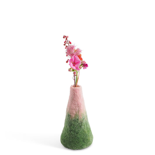 Vase with a gradient from pink to green filled with flowers on a white background