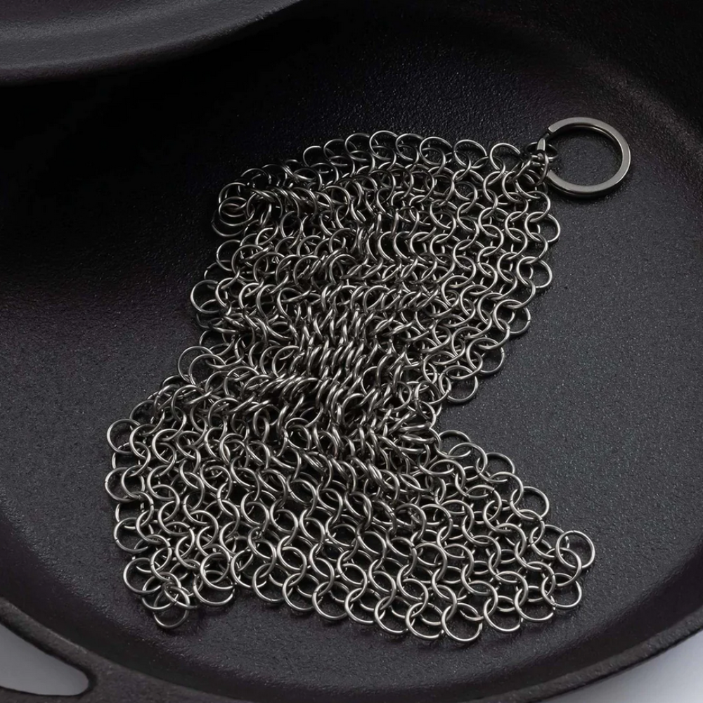 Stainless steel cleaning mesh for use with cast iron skillets and dutch ovens. Textured surface helps to remove stuck-on food, grime, and oil from pans and excels at heavy-duty cleaning. Built to last through years of frequent use and won’t scratch or scar your cookware. Dishwasher safe. An essential cast iron cleaning tool!