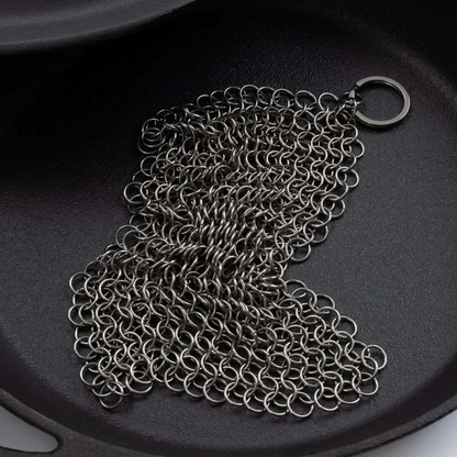Stainless steel cleaning mesh for use with cast iron skillets and dutch ovens. Textured surface helps to remove stuck-on food, grime, and oil from pans and excels at heavy-duty cleaning. Built to last through years of frequent use and won’t scratch or scar your cookware. Dishwasher safe. An essential cast iron cleaning tool!