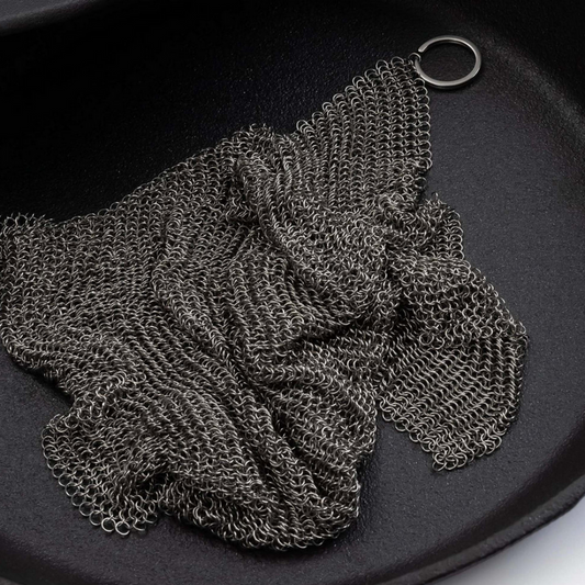 Stainless steel cleaning mesh for use with cast iron skillets and dutch ovens. Textured surface helps to remove stuck-on food, grime, and oil from pans and excels at heavy-duty cleaning. Built to last through years of frequent use and won’t scratch or scar your cookware. Dishwasher safe. An essential cast iron cleaning tool!