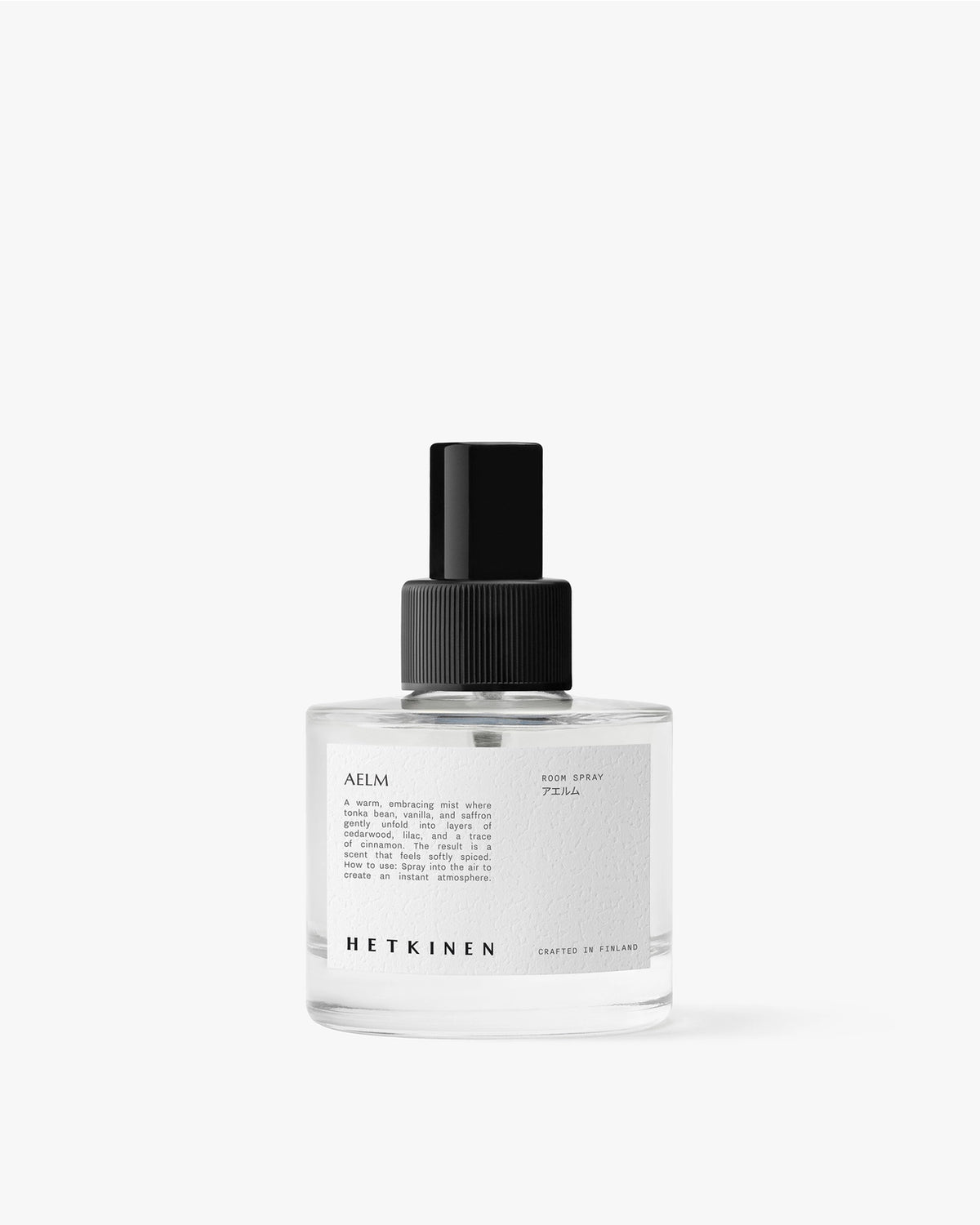Clear spray bottle with black cap on a white background