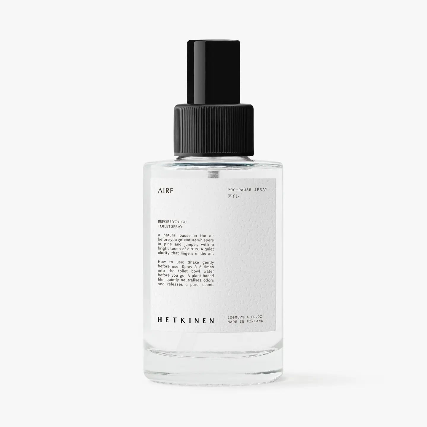 Clear spray bottle labeled 'AIRE' with black cap on a white background