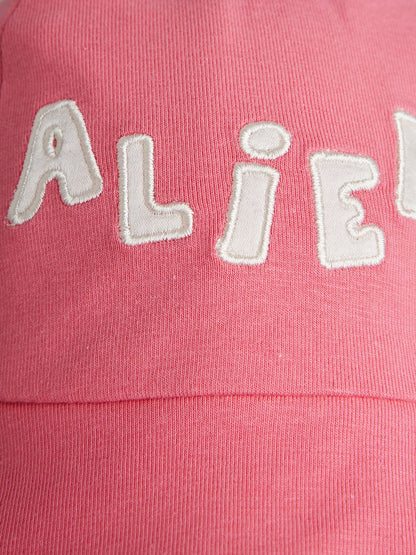 Pink Fabric with 'ALIEN' text in white on a pink background