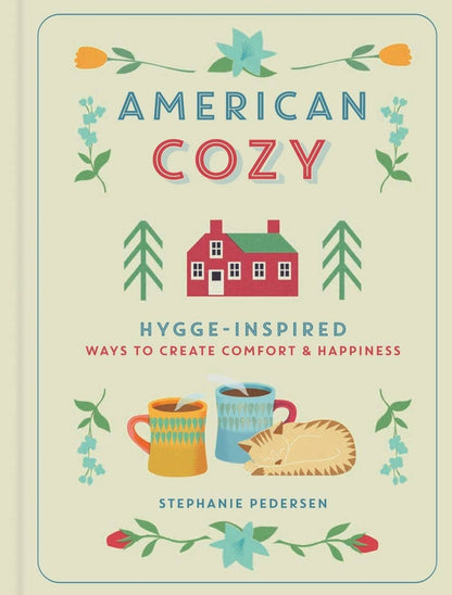 Book cover of 'American Cozy' with illustrations of a house, mugs, and a cat on a beige background.