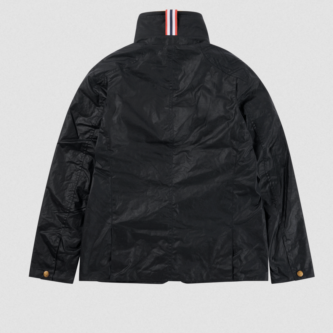 The back view of a black waxed cotton jacket with a high collar featuring a signature red, white, and blue striped ribbons, and brown buttons on the cuffs.