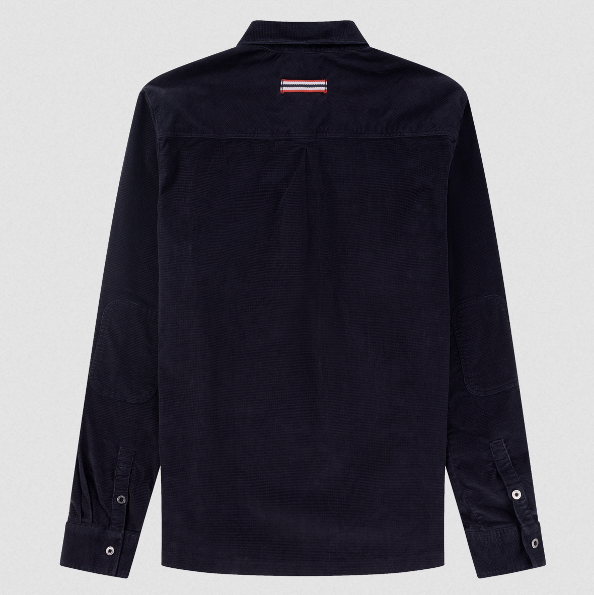 A dark navy blue long-sleeve button-up shirt shown from the back, featuring a small red, white, and blue striped logo patch on the upper back neck, set against a light gray background.