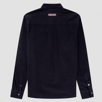 A dark navy blue long-sleeve button-up shirt shown from the back, featuring a small red, white, and blue striped logo patch on the upper back neck, set against a light gray background.