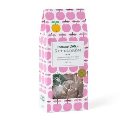 A package of tehuäsel JYFA apple cräme, featuring a white box with a pink apple pattern, a clear window showing the contents, and a gold seal on the right side.
