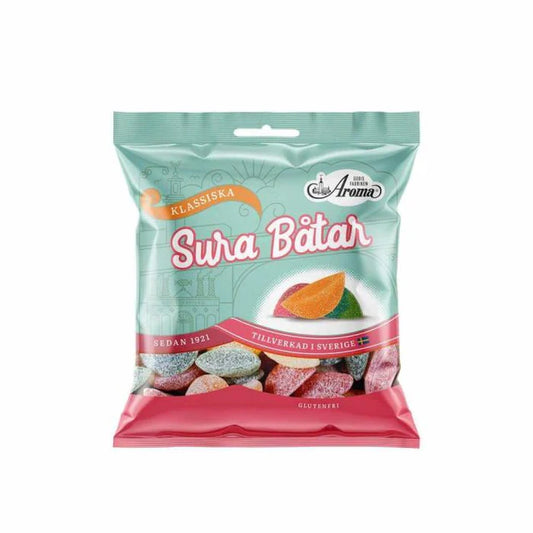 Aroma Sour Boats are a delightful Swedish candy featuring a fun boat shape and a bold mix of fruity and sour flavors. Coated in a sugary layer for an extra tangy kick, they’re perfect for those who love a zesty treat. These candies are also gluten-free, making them a great option for individuals with gluten sensitivities. Ideal for snacking or sharing, Aroma Sour Boats bring a burst of flavor and fun to any occasion!