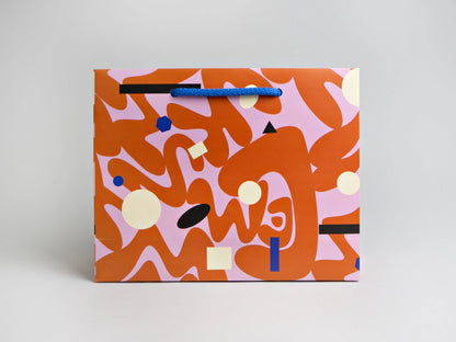 This luxury gift bag made from 200gsm card measures 25 x 20 cms, and is 8 cms deep. It's approximately A5 size. It has heavy cotton handles and can be used again if looked after.