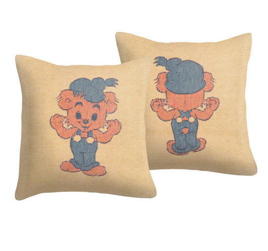 Two pillows with embroidered teddy bear designs on a beige background