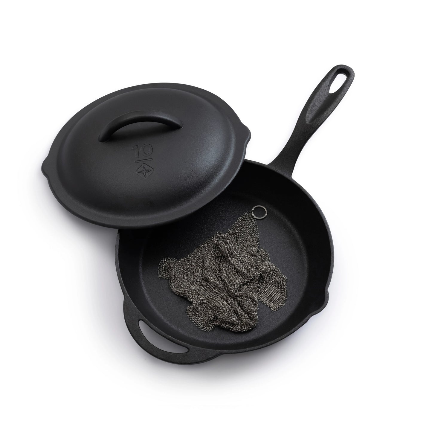 Black cast iron skillet with lid on a white background