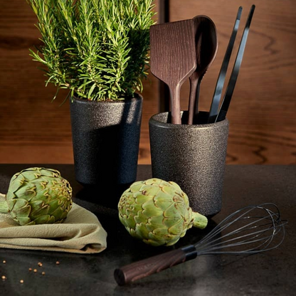 Designed by Jesper Vollmer who is both a cook and designer and has worked at top restaurants as a professional chef. He wants to inspire people to eat just a little bit better with his designs. Featuring a durable, gun-metal-colored coating and provide you with a great grip on the food, the best balance and optimal bounce. The curvaceous metal prongs were designed to help with precision cooking.