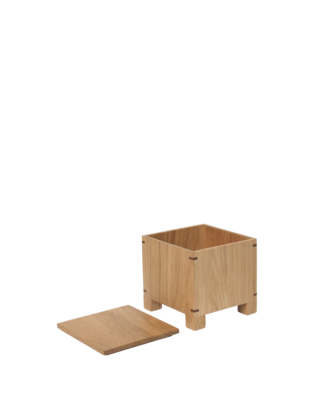 The Bon Garlic Box is a thoughtful addition to the Bon Collection. Crafted from delicate, solid oak sheets, it showcases a refined aesthetic that combines craftsmanship with functionality. The box features precise corner joints and ventilation holes at the base, keeping garlic fresh and dry while protecting it from sunlight. Handcrafted from FSC™-certified wood, the design balances elegance with modern utility, making it a perfect fit for contemporary kitchens.