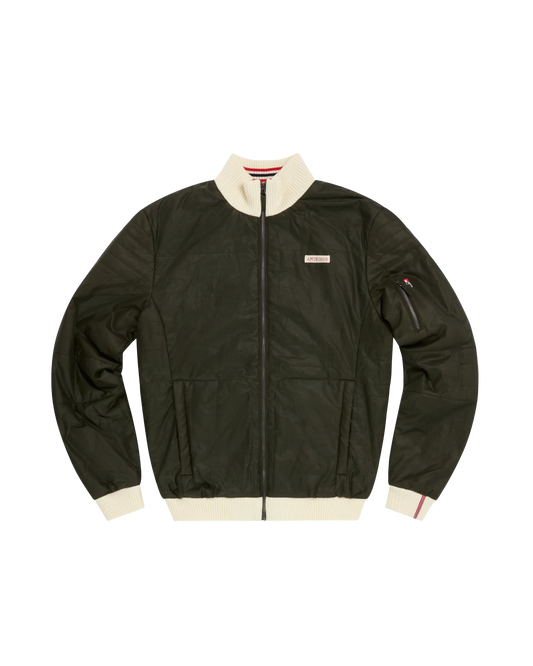 An olive green waxed cotton bomber jacket with cream ribbed trim on the collar, cuffs, and hem, featuring a front zipper, zippered sleeve pocket, and a small rectangular brand patch on the left chest.