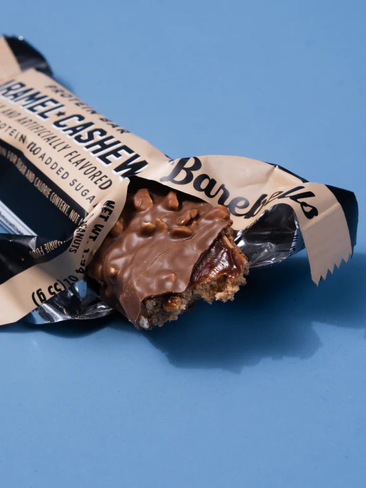 Chocolate bar with caramel and cashew flavor on a blue background