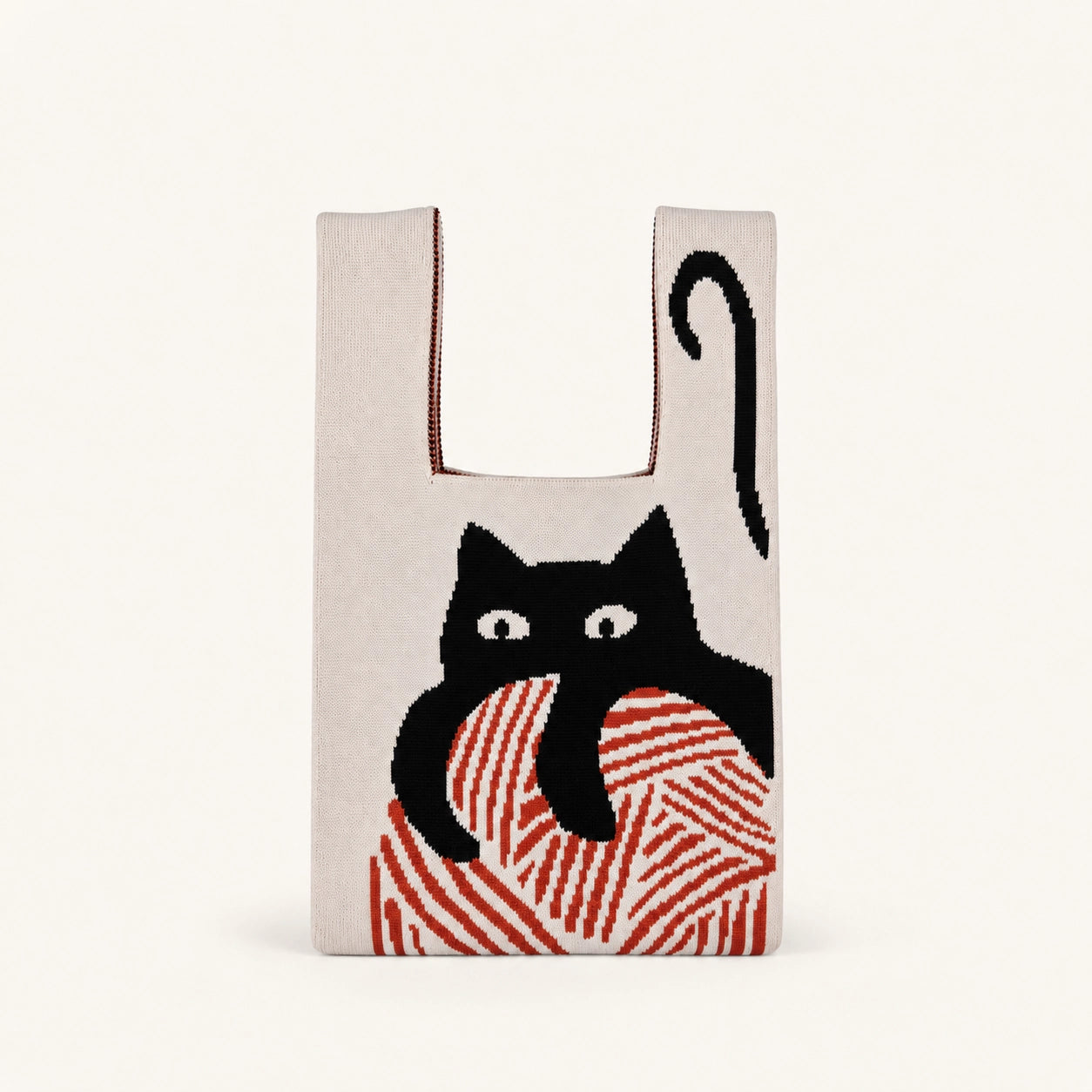 Reusable shopping bag with a black cat design on a beige background